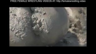 Girls wrestling in the mud