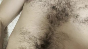 Hairy boy creaming own mouth, face and body